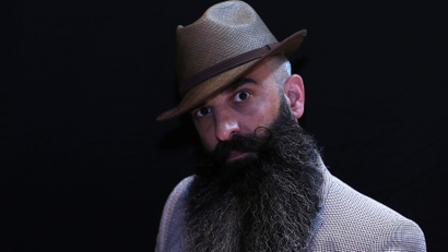 A participant of the international World Beard and Moustache Championships poses before taking part in one of the 17 categories of beard and moustache styles competing in Antwerp, Belgium May 18, 2019.