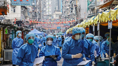 Health workers are seen in protective gear inside a locked down portion of the Jordan residential area to contain a new outbreak of the coronavirus disease (COVID-19), in Hong Kong.