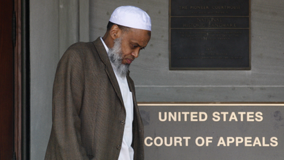 FILE - This May 11, 2012 file photo, Portland Imam Mohamed Sheikh Abdirahman Kariye, who is one of 15 men who say their rights were violated because they are on the U.S. government's no-fly list, leaves the United Sates Court of Appeals following oral arguments on the ACLU No Fly List challenge, in Portland, Ore. A federal judge has ruled Tuesday, June 24, 2014, that the U.S. government violated the rights of 13 people on its no-fly list by depriving them of their constitutional right to travel, and gave them no adequate way to challenge their placement on the list.