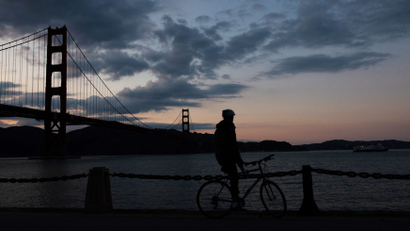 A cyclist is seen near the Golden Gate Bridge after lockdown orders were issued for the coronavirus pandemic on March 20.