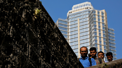 Office workers climb down a bridge in Mumbai's central financial district