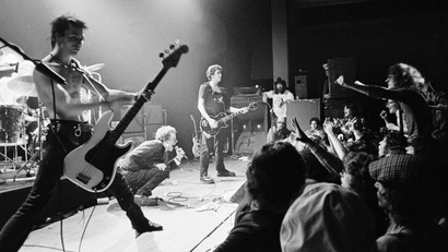 English punk rock group "Sex Pistols" get a form of audience participation on January 7, 1978 in Memphis, Tenn., during the second stop of their American tour. In left foreground is bass player Sid Vicious while group leader Johnny Rotten crouches in foreground.