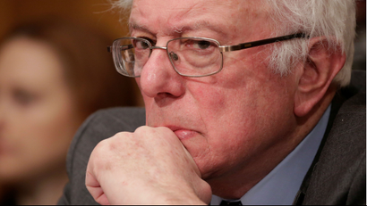 Bernie Sanders sits with a furrowed brow and frown during the Senate HELP Committee hearing for Tom Price.