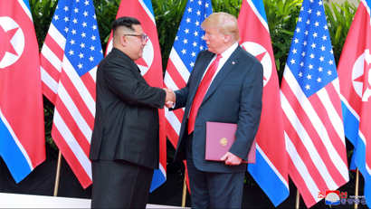 U.S. President Donald Trump shakes hands with North Korean leader Kim Jong Un at the Capella Hotel on Sentosa island in Singapore in this picture released on June 12, 2018 by North Korea's Korean Central News Agency.
