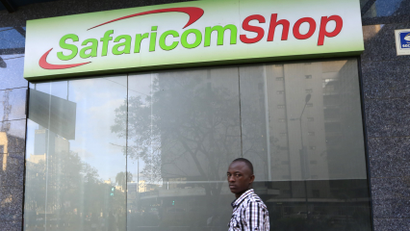A man walks past a Safaricom shop, a mobile telecommunication provider in Kenya's capital Nairobi November 15, 2015.