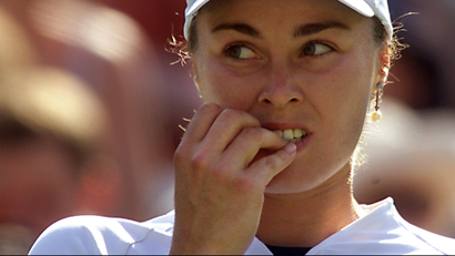 tennis player chewing on nails