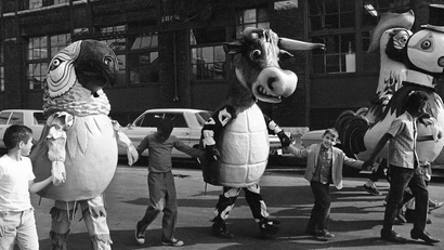 Chicago school children walk hand-in-hand with costumed animals made of papier-mache in Chicago, Sept. 13, 1967 during “test day” for the paper characters. The animals will be part of a Christmas parade in Chicago on November 26. (AP Photo/Charles Knoblock)