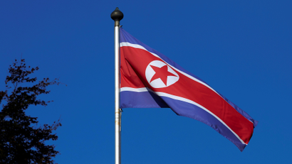 A North Korean flag flies on a mast at the Permanent Mission of North Korea in Geneva October 2, 2014.