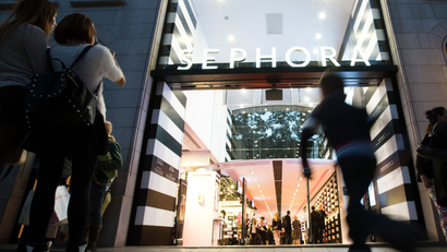 People walk past the Sephora store on the Champs Elysees Avenue in Paris October 6, 2013. LVMH-owned cosmetics store Sephora was forced to close its Champs Elysees outlet at 9 p.m. (2000 GMT) instead of midnight after labour unions won a ruling last month to impose an earlier evening closure time. REUTERS/Gonzalo Fuentes (FRANCE - Tags: BUSINESS EMPLOYMENT) - GM1E9A708EI01