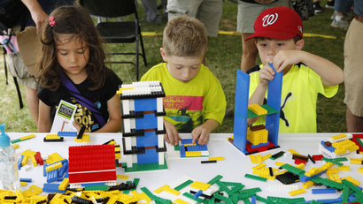 lego research lab stem girls boys gender toys In this photograph released on Wednesday, June 18, 2014, in celebration of National Day of Making, three junior makers showcase LEGO® building skills at first ever DC Mini Maker Faire on Sunday, June 8, 2014 in Washington. (Paul Morigi/AP Images for LEGO