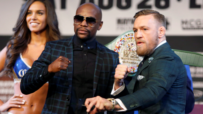 Floyd Mayweather Jr. (L) of the U.S. and UFC lightweight champion Conor McGregor of Ireland pose during a news conference in Las Vegas, Nevada U.S. on August 23, 2017