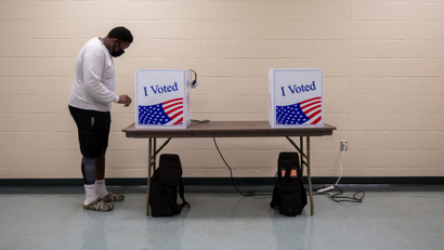 A person casts his ballot for the upcoming presidential election during early voting in Sumter, South Carolina, U.S., October 9, 2020.