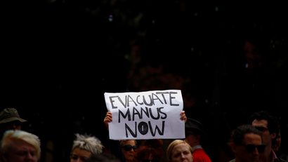 Refugee advocates hold placards as they participate in a protest in Sydney, Australia, against the treatment of asylum-seekers at Australia-run detention centres located at Nauru and Manus Island.