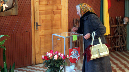 A woman vote during the second round of Lithuanian parliamentary election in Birzai, Lithuania, 23 October 2016.