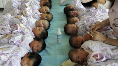 Newly born babies receive vaccines at a hospital in Aksu, Xinjiang Uighur Autonomous Region.