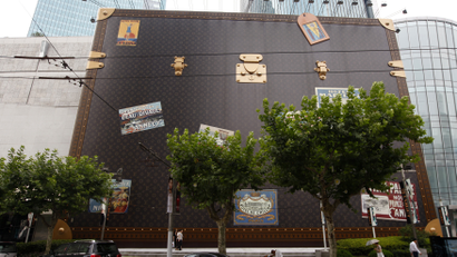 A giant suitcase for Louis Vuitton is on display outside a Louis Vuitton store in Shanghai, August 2, 2010. The world's top luxury brands like Burberry and Coach are pouring funds into China's multi-billion dollar luxury market, wresting control of their brands from Chinese partners as they swoop back in a market set to become the world's No.1. Picture taken August 2, 2010.