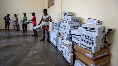 Employees of Snapdeal, an Indian online retailer, sort out delivery packages inside their company fulfilment centre in Mumbai