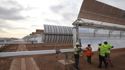 Workers at the building site of Morocco's Noor I solar power plant