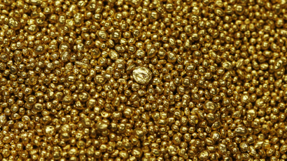 Gold granulate is seen at a plant of gold refiner and bar manufacturer Valcambi SA in the southern Swiss town of Balerna December 20, 2012. Picture taken December 20, 2012. To match story SWISS-GOLD/ REUTERS/Michael Buholzer (SWITZERLAND - Tags: BUSINESS)