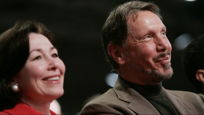 Oracle CEO Larry Ellison and CFO Safra Catz smile during a conference in San Francisco.