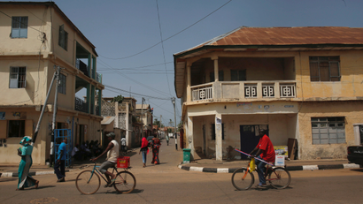 People move in the street in Banjul, Gambia