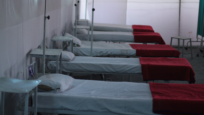 A row of empty beds in a medical clinic