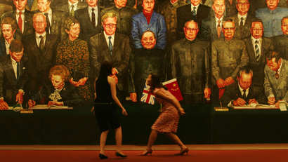 artist Ma Baozhong during the preview of the collection of reunification art at Sotheby's auction in Hong Kong Tuesday, June 26, 2007 to celebrate the 10th Anniversary of Hong Kong handover to China. The painting shows the Sino-British Joint Declaration was signed on Dec. 19, 1984 at the West Hall of the Great Hall in Beijing