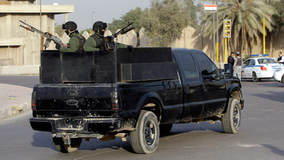 A private security company's armored vehicle rolls through al-Nisoor square,Baghdad, Iraq, Saturday, Jan. 2, 2010. A U.S. federal judge has dismissed all charges against five Blackwater Worldwide security guards accused in the 2007 killing of unarmed Iraqi civilians, in a case that has inflamed anti-American sentiment in Iraq.