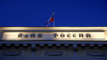 A Russian state flag flies over the Central Bank