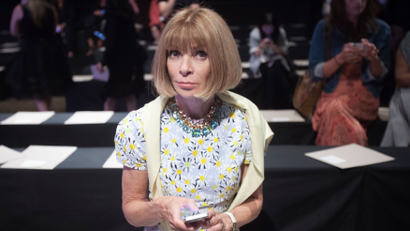 Vogue editor Anna Wintour sits in her seat before the Donna Karan Spring/Summer 2015 collection show during New York Fashion Week in the Manhattan borough of New York September 8, 2014. REUTERS/Carlo Allegri (UNITED STATES - Tags: FASHION ENTERTAINMENT) - GM1EA990KPG01