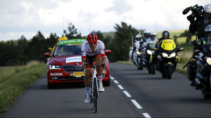 Cyclist in the Tour de France followed by cameramen