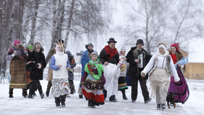 People dance and sing Christmas carols, known locally as "Kolyadki", in the village of Noviny
