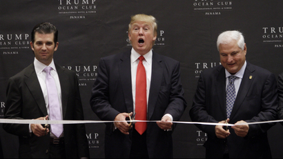 Trump and his son Donald Jr. open the hotel alongside Panamas president in 2011.
