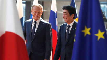 Japan's Prime Minister Shinzo Abe (R) is welcomed by European Council President Donald Tusk at the start of a European Union-Japan summit in Brussels, Belgium July 6, 2017.
