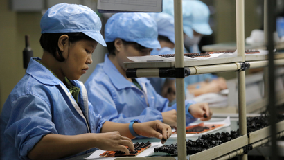 In this Aug. 21, 2015 photo, Chinese women work at Rapoo Technology factory in southern Chinese industrial boomtown of Shenzhen. Factories in China are rapidly replacing those workers with automation, a pivot thats encouraged by rising wages and new official directives aimed at helping the country move away from low-cost manufacturing as the supply of young, pliant workers shrinks.