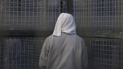 An inmate stands against a fence at the Adjustment Center yard during a media tour of California's Death Row at San Quentin State Prison in San Quentin, California December 29, 2015. America's most populous state, which has not carried out an execution in a decade, begins 2016 at a pivotal juncture, as legal developments hasten the march toward resuming executions, while opponents seek to end the death penalty at the ballot box. To match Feature CALIFORNIA-DEATH-PENALTY/ Picture taken December 29, 2015. REUTERS/Stephen Lam - RTX21EDP
