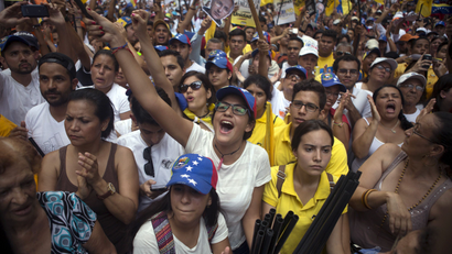 Opposition supporters shout during a rally in support of the political leaders in prison in Caracas