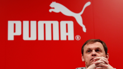 FILE PHOTO: Bjoern Gulden, CEO of German sports goods firm Puma, attends the company's annual news conference in Herzogenaurach February 20, 2014. REUTERS/Michaela Rehle/File Photo - RC1604329A20