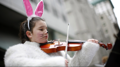 Girl playing violin in bunny costume