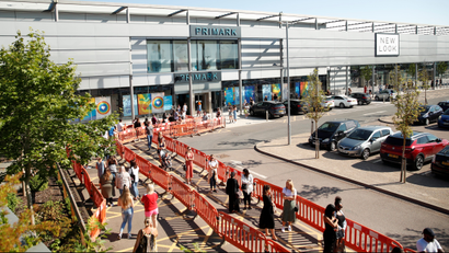 People queue to enter a Primark store as it is re-opening following the coronavirus disease (COVID-19) outbreak