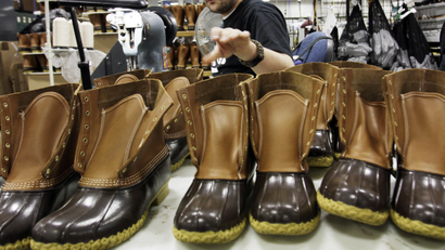 n this Dec. 14, 2011, file photo, Eric Rego stitches boots in the facility where LL Bean boots are assembled in Brunswick, Maine. L.L. Bean is kicking it up a notch as demand continues to surge for its iconic boot. The Maine-based outdoors retailer has leased a 110,000-square-foot building and plans to install a third injection-molding machine. The company is boosting production to meet demand that's expected to reach 1 million pairs in 2018. (AP Photo/Pat Wellenbach, File)