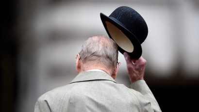 Prince Philip takes off his bowler hat