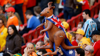 Australia fans hold an inflatable kangaroo wearing an Australia flag before the team's 2014 World Cup Group B soccer match against Netherlands at the Beira Rio stadium in Porto Alegre June 18, 2014. REUTERS/Marko Djurica (BRAZIL - Tags: SOCCER SPORT WORLD CUP) - TB3EA6I1AUN3B