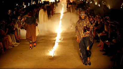 Models wear creations for Gucci's Cruise 2019 fashion collection at the ancient site of Alyscamps in Arles, southern France, Wednesday, May 30, 2018. (AP Photo/Claude Paris)