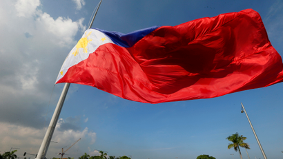 A giant Philippine flag is raised during a ceremony to celebrate the 118th Philippine Independence Day rites at the Rizal Park Sunday, June 12, 2016 in Manila, Philippines. Philippine President Benigno Aquino III led the rites for the last time as he is to relinquish his presidency to President-elect Rodrigo Duterte at the end of the month. (AP Photo/Bullit Marquez)