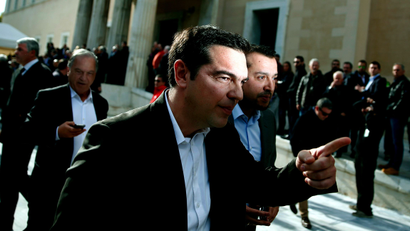 Alexis Tsipras, opposition leader and head of radical leftist Syriza party, leaves the parliament building after the last round of a presidential vote in Athens December 29, 2014. Greek Prime Minister Antonis Samaras said he would propose holding an early national election on Jan. 25 after parliament rejected his nominee for president.