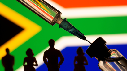 Illustration of a vial and syringe by a South African flag