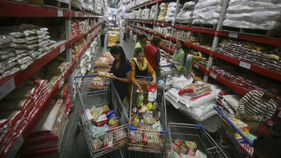 Customers shop inside a Best Price Modern Wholesale store, a joint venture of Wal-Mart Stores Inc and Bharti Enterprises, at Zirakpur in the northern Indian state of Punjab
