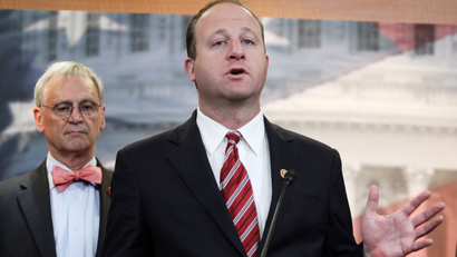 Rep. Jared Polis, D-Colo., right, accompanied by Rep. Earl Blumenaurer, D-Ore., speaks during a news conference on Capitol Hill in Washington, Thursday, Nov. 13, 2014, to discuss marijuana laws. Members of Congress from states with legal pot are banding together to tell their colleagues on Capitol Hill not to interfere with state drug laws. (AP Photo/Lauren Victoria Burke)