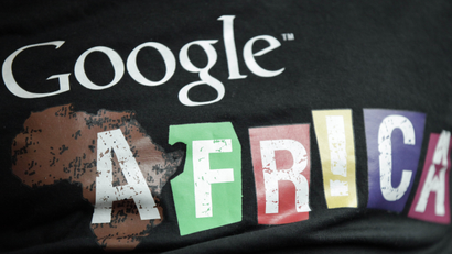In this photo taken, Thursday, Sept.13, 2012. A staff member wears a T-shirt bearing the name of Google Africa, in Lagos, Nigeria. With all its cutting-edge technology, Google Inc. has turned back to the text message in its efforts to break into Nigerias booming economy. The search engine has started a service in Nigeria, as well as Ghana and Kenya, allowing mobile phone users to access emails through text messaging. That comes as the companys office in Lagos has begun working with small business owners in this nation of more than 160 million people.